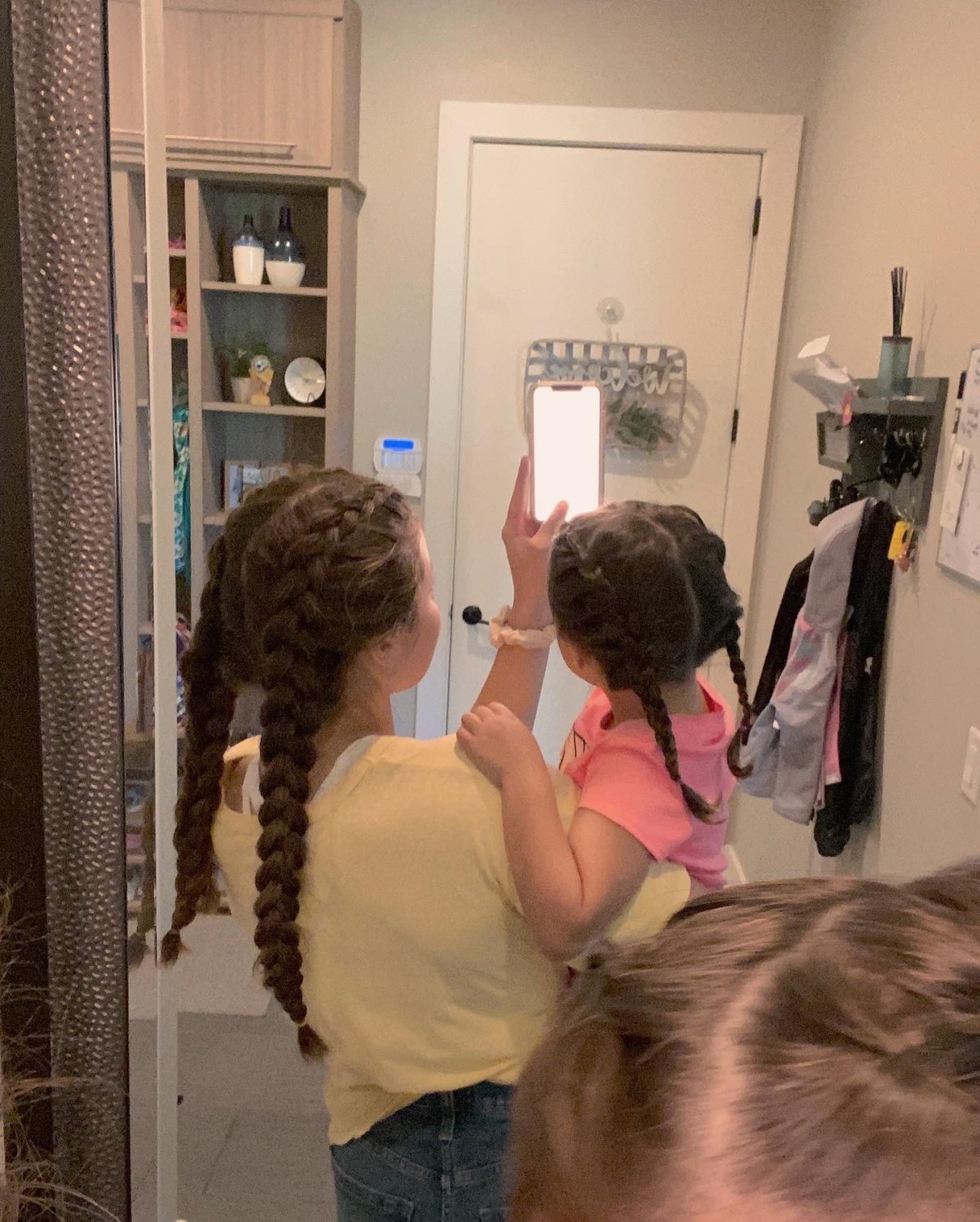 Twins braid mirror selfie 